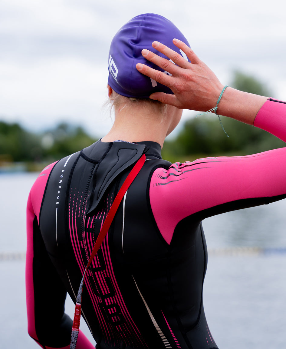 HUUB Surface Wetsuit Fluo Pink women’s open water suit, high-visibility arms & cuffs, and maximum flexibility panels